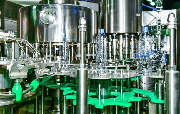 istock Clear plastic Bottles transfer on Automated conveyor systems 1155601158