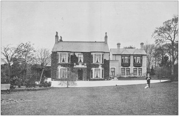 istock Antique vintage black and white photo: British countryside house 1155601338