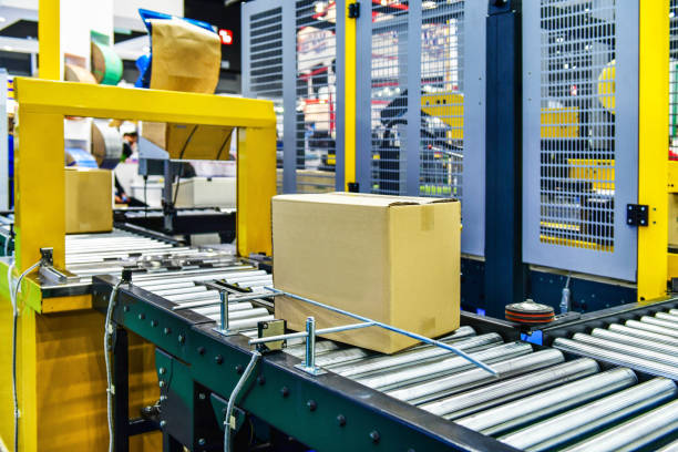 istock Cardboard boxes on conveyor belt.industry concept 1155602815