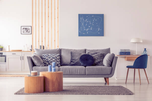 istock Wooden mullins wall in bright open plan studio apartment with kitchen and living room 1155604599