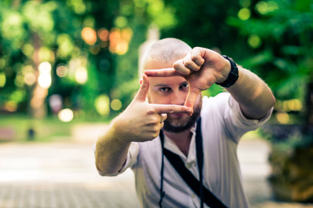 istock Creative Photographer Framing a Shot with his Fingers 1155606464