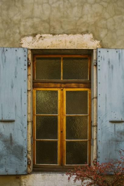 istock Old city scene: windows with vintage wooden shutters 1155606471
