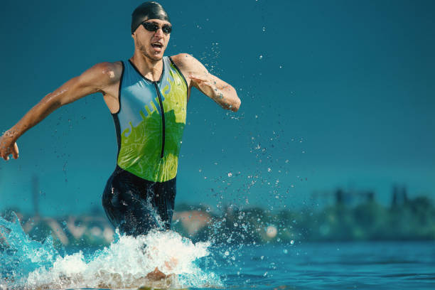 istock Professional triathlete swimming in river's open water 1155607683