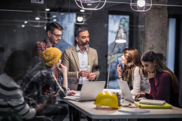istock Team of freelance workers having a meeting in the office. 1155607698