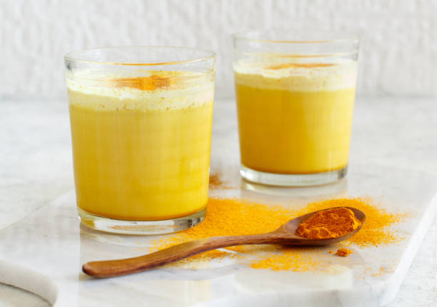 istock Golden milk with turmeric powder 1155613471