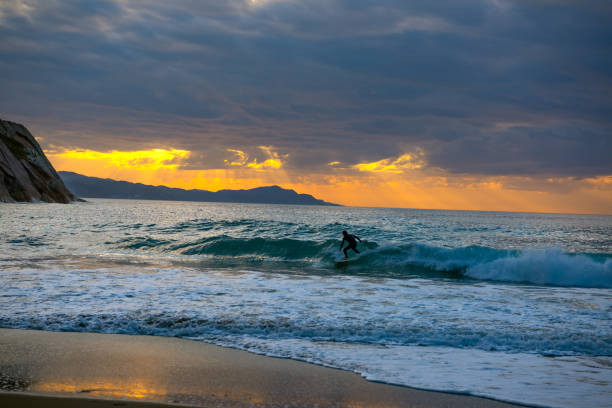 istock Golden sunset with sun's rays over the ocean. 1155614710