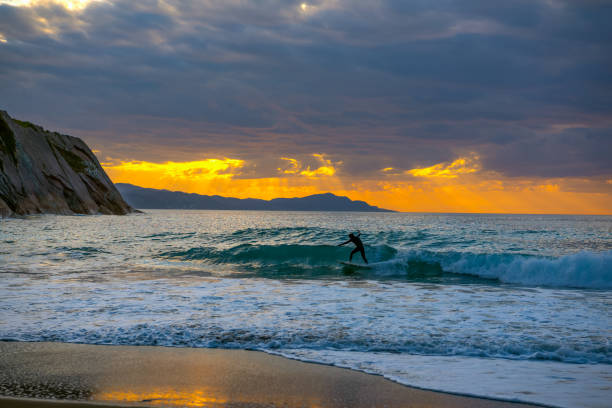 istock Golden sunset with sun's rays over the ocean. 1155614729