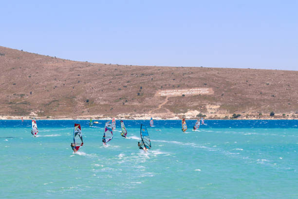 Windsurfing in a bay off the coast of Crete island, Greece