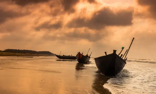 Silhouette Boats anchored on the at Digha beach.