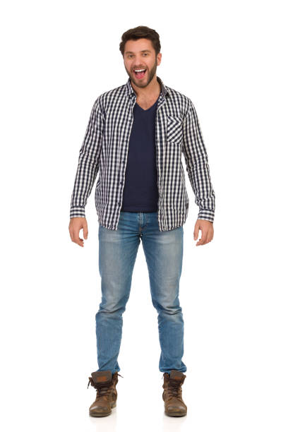 istock Happy Handsme Man In Jeans And Unbuttoned Lumberjack Shirt Is Talking. Front View. 1155617879