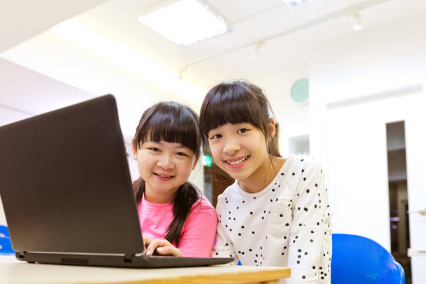 istock Portrait of smiling students in STEM class 1155622381