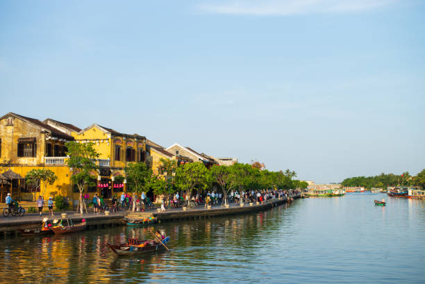 Hoi An old town Thu Bon riverside evening view with tourists