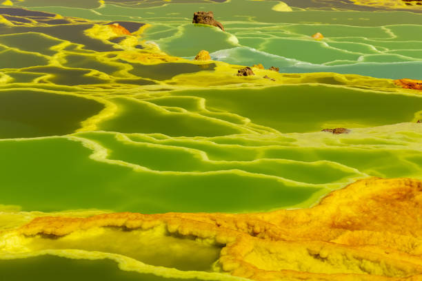 Dallol, Ethiopia. Danakil Depression Beautiful green color water in small sulfur lakes Dallol, Ethiopia. Danakil Depression is the hottest place on Earth in terms of year-round average temperatures. It is also one of the lowest places on the planet dallol ethiopia stock pictures, royalty-free photos & images