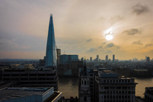 istock The shard with the sun in the clouds. 1155630625