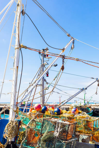 istock Crayfish nets and traps on a small fishing boat 1155634658