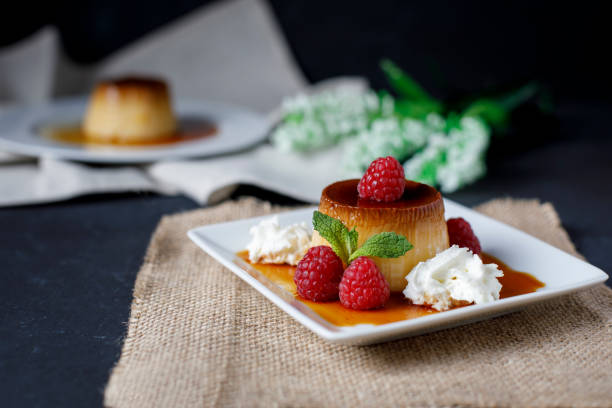 istock Egg flan with raspberries and mint leaves 1155635560