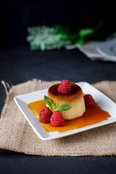 istock Egg flan with raspberries and mint leaves 1155635566
