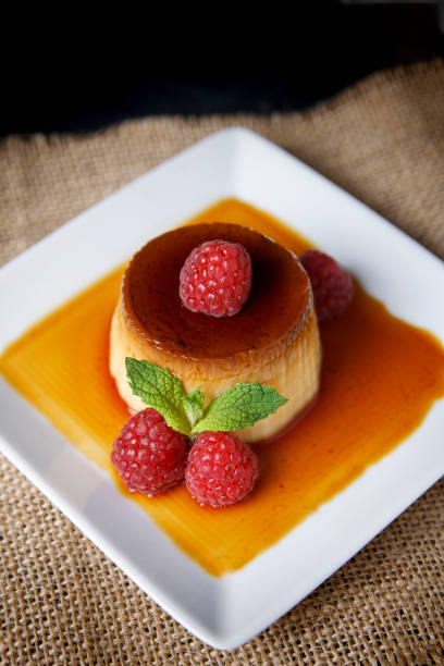 istock Egg flan with raspberries and mint leaves 1155635603