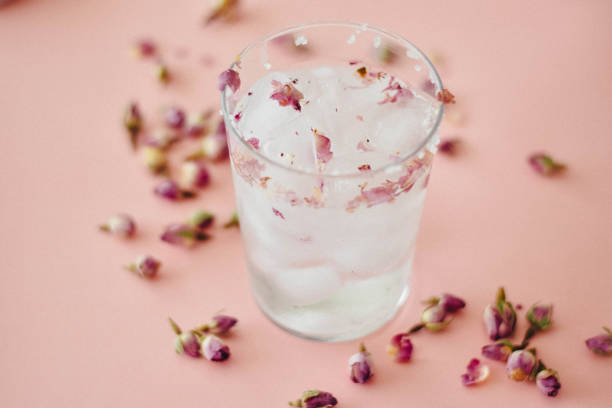 Rose water drink cool on pink and marble background stock photo