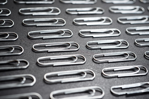 Paperclips group on a black table