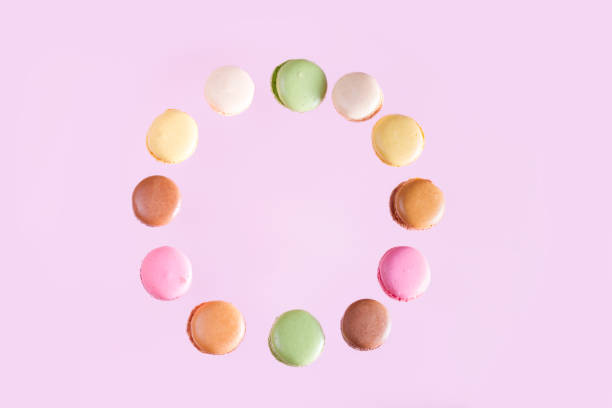 Macaroons cookies on pink