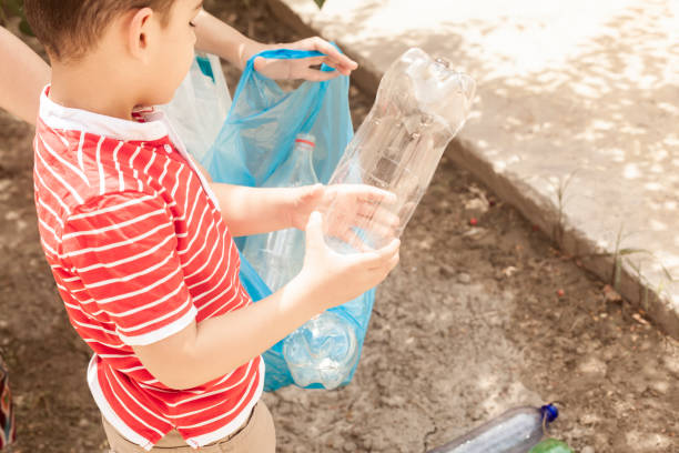istock Mother and son collecting plastic bottles 1155646999