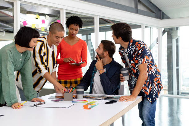 istock Business people discussing over documents at conference room 1155649399