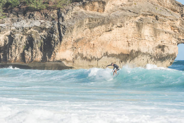 istock Solo male surfer in Hawaii dropping in 1155650134