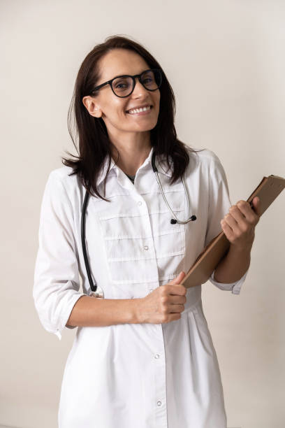 istock Young charming doctor on an isolated background 1155650550