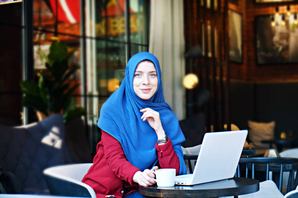 istock Young muslim woman at hip coffee place. 1155653051