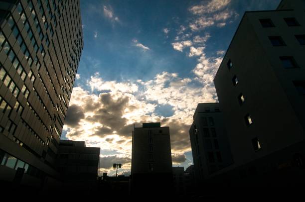 istock clouds and silhoutetted skyscrapers downtown 1155657648