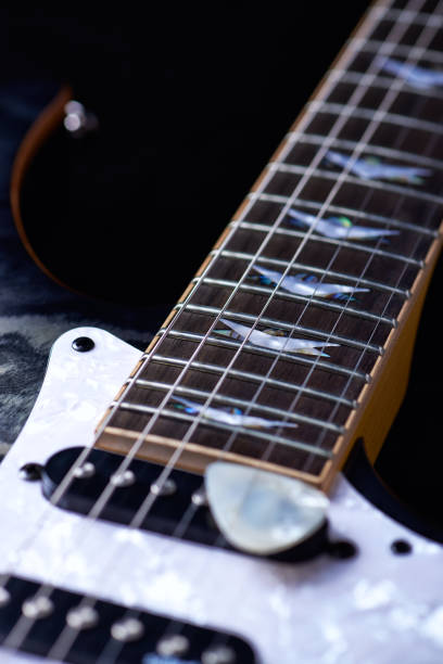 istock Electric guitar close up. Black background. 1155658160