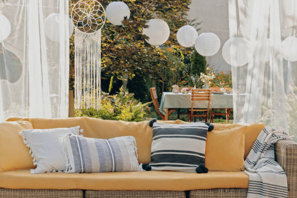 istock Patterned pillows on the garden settee, real photo 1155666192