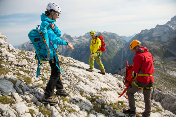 istock Three mountaineers just reached the top 1155666355