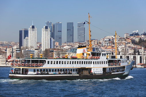 Istanbul, Turkey - March 18, 2019: People are getting on the ferry boat in Eminonu. Every day nearly 150,000 passengers use ferries in Istanbul.
