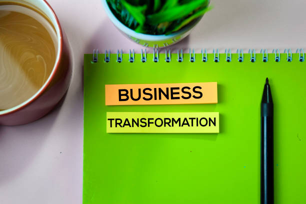 istock Business Transformation text on sticky notes with office desk concept 1155669310