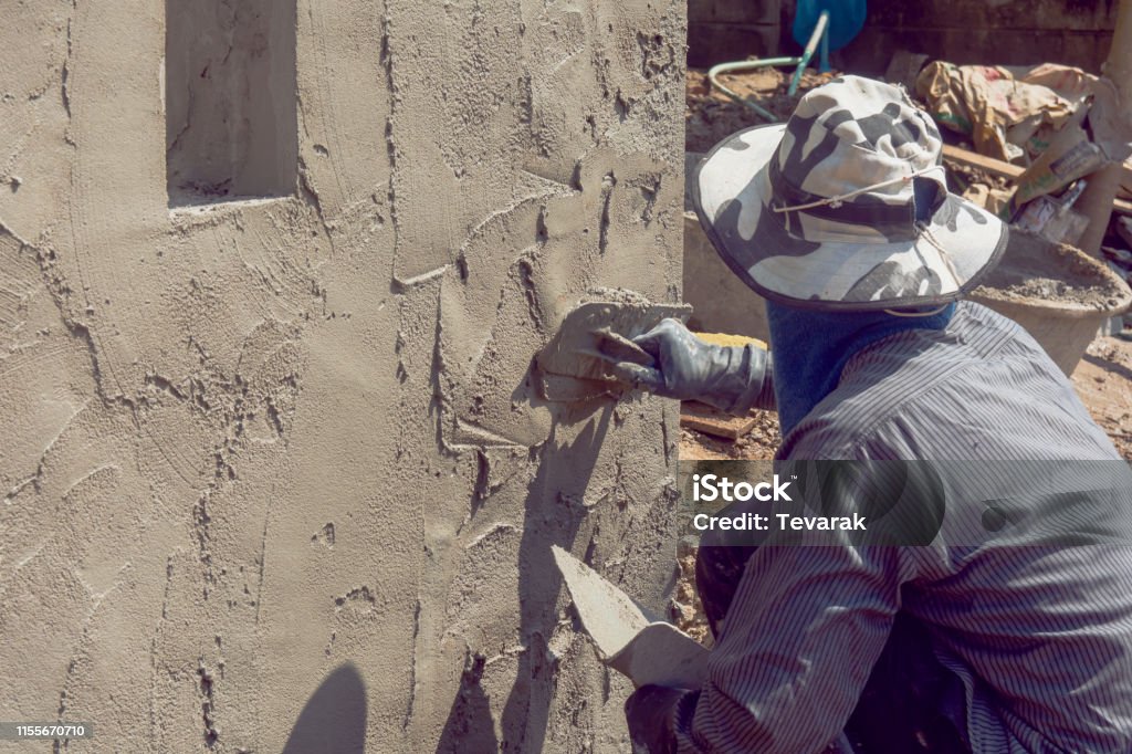 Plastering In Construction Construction Workers Plastering Building Wall Using Cement Plaster ...