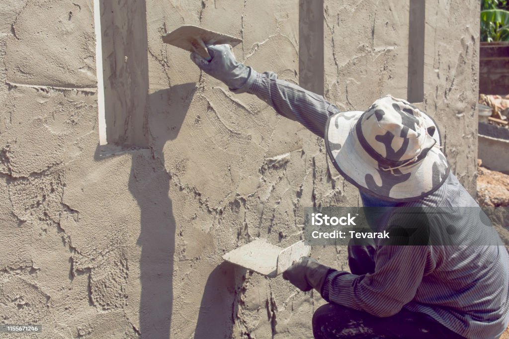 Plastering In Construction Construction Workers Plastering Building Wall Using Cement Plaster ...