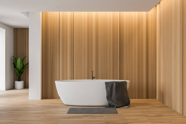 istock Wooden and white bathroom with white tub 1155671368