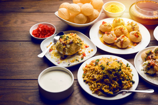 Bombay Chat food in group group of Bombay chat food includes golgappa/panipuri, bhel-puri, sev-poori, dahipuri, Ragda pattice, raj kachori etc. selective focus raj kachori stock pictures, royalty-free photos & images
