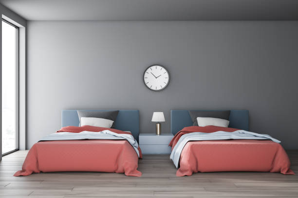 istock Gray bedroom interior with two beds and clock 1155673902