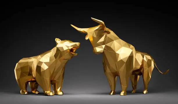 Golden bull and bear in low poly representation against a dark background