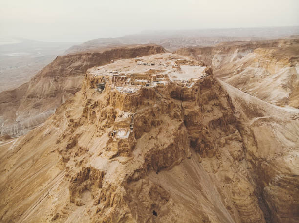 masada fortress area southern district of israel dead sea area southern district of israel. ancient jewish fortress of the roman empire on top of a rock in the judean desert, front view from the air - cloud mid air cloudscape aerial view imagens e fotografias de stock