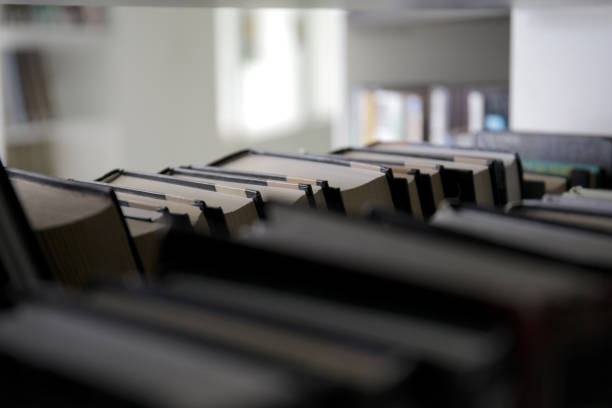 istock stack of books on a shelf in a bookcase 1155678675