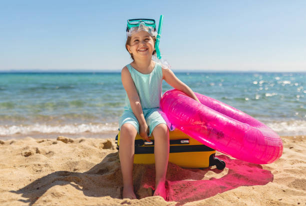 istock Smiling girl can't wait to try her new inflatable ring 1155678946