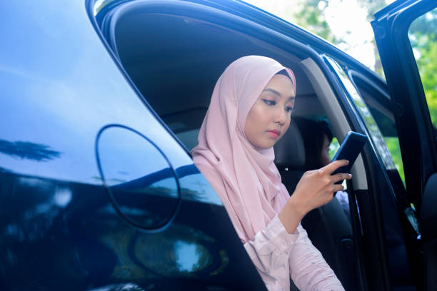istock Asian Muslim businesswoman using smartphone 1155685656