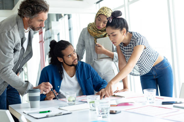 istock Business people working together at conference room in a modern office 1155687898