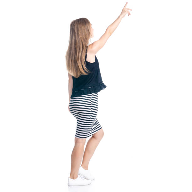 istock Woman in skirt showing pointing 1155689869