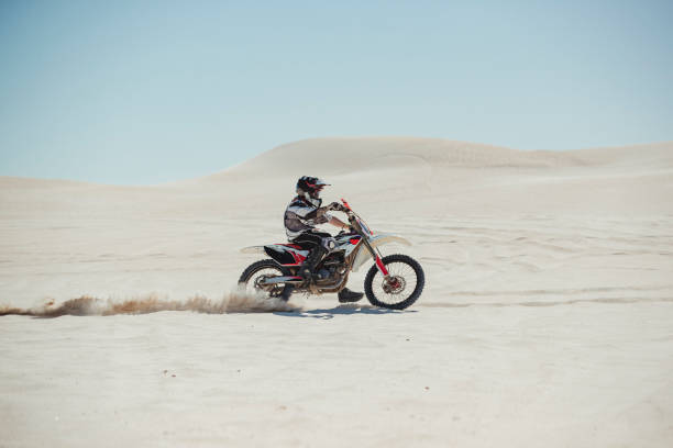istock Motorcyclists Takes to the Sand 1155690636