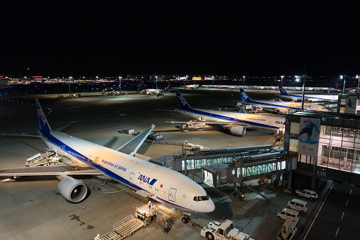 Amsterdam, Netherlands - October 19, 2022: A panorama picture of multiple planes at the Schiphol Airport.